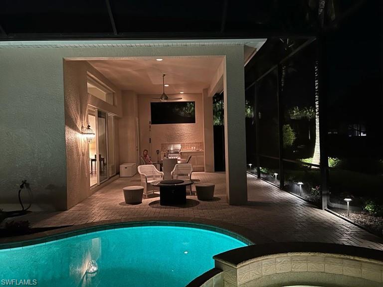 938 Spanish Moss Trail Naples, FL 34108 - Photo 8 of 11 a living room with patio bathtub and dining room