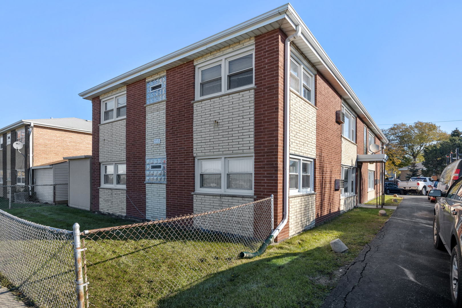 7535 Roberts Road Bridgeview, IL 60455 - Photo 1 of 30 a front view of a house with a yard
