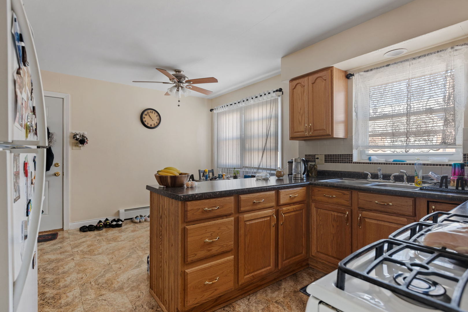 7535 Roberts Road Bridgeview, IL 60455 - Photo 19 of 30 a kitchen with sink cabinets and window