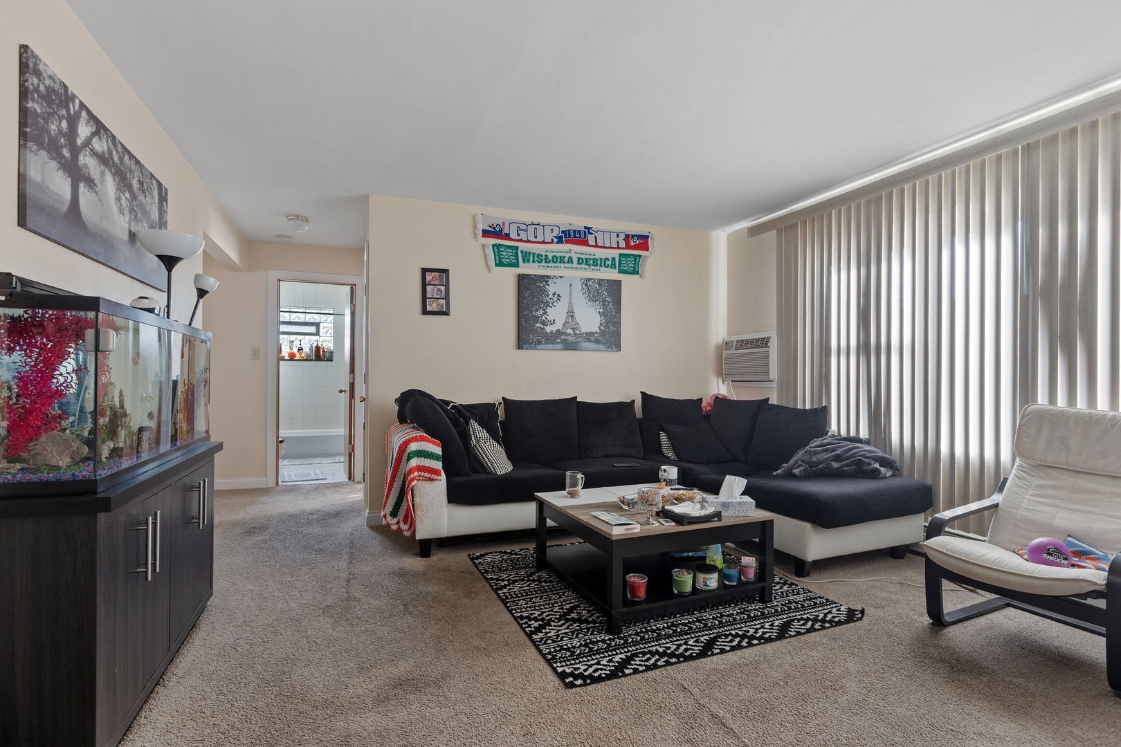 7535 Roberts Road Bridgeview, IL 60455 - Photo 20 of 30 a living room with furniture and a flat screen tv