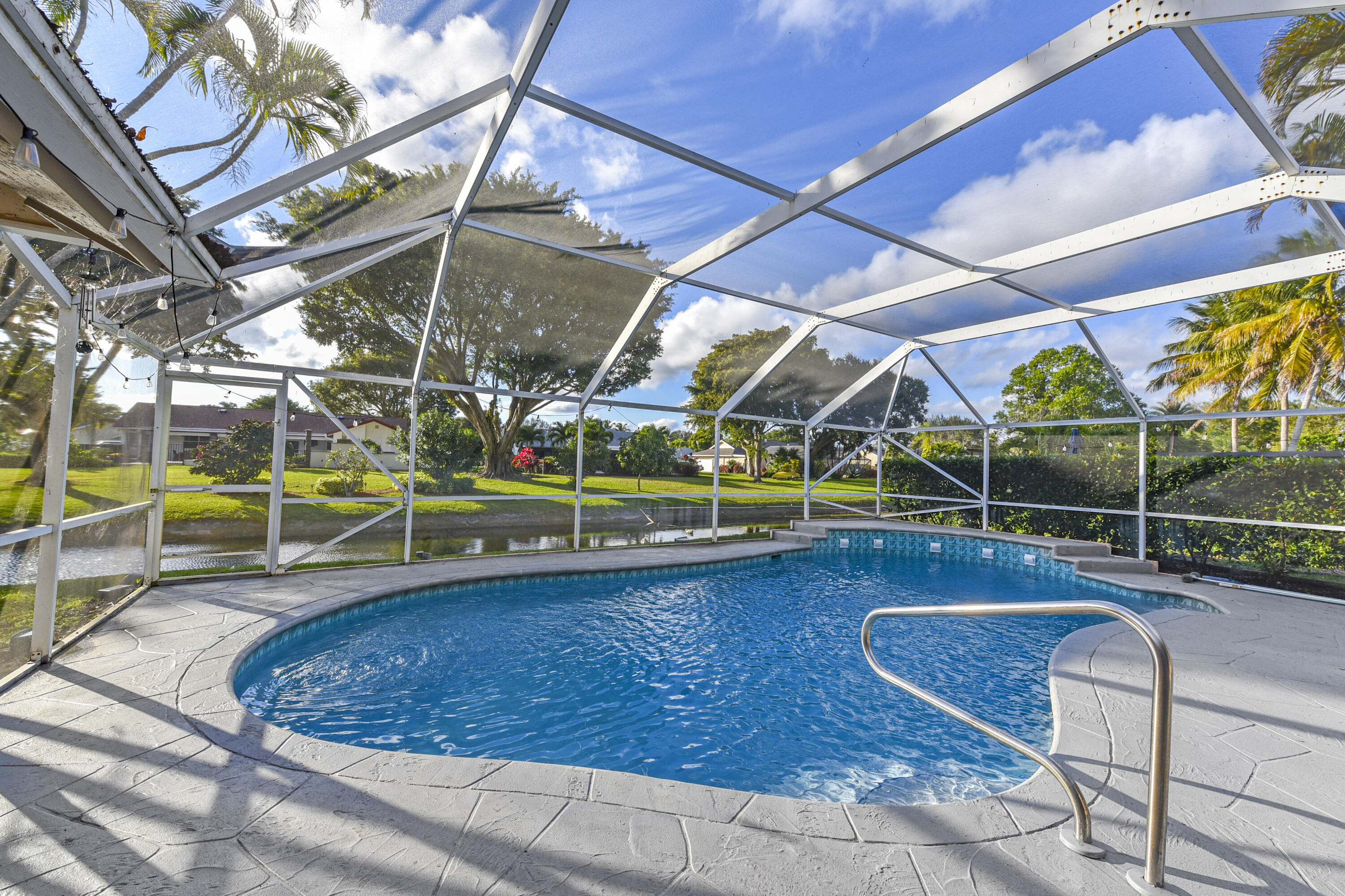 a view of a swimming pool with a patio