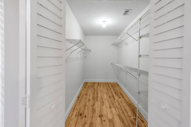 a view of a room with racks on the wall