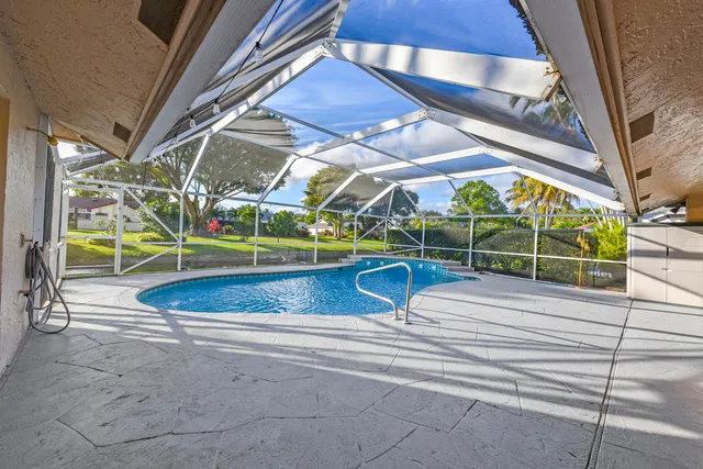 a view of a swimming pool with a patio