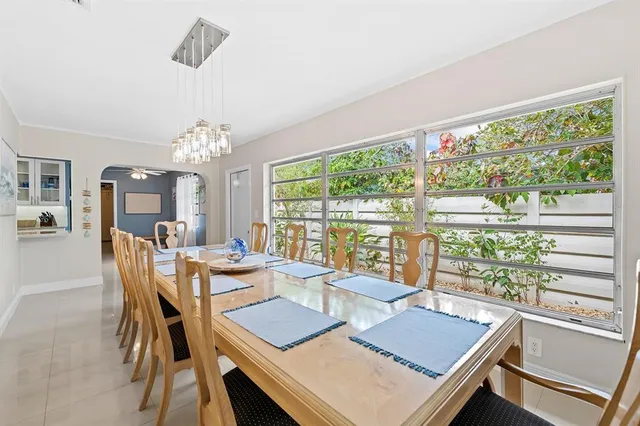 a view of a dining room with furniture window and outside view