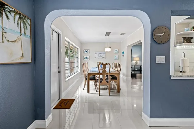 a living room with furniture and a clock