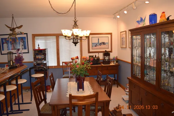 a view of a dining room with furniture window and outside view