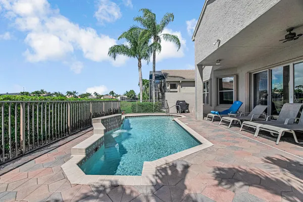 a view of a swimming pool with a lounge chair