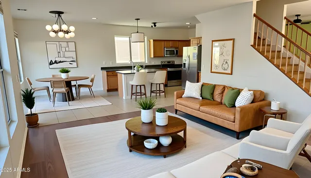 a living room with furniture and a chandelier