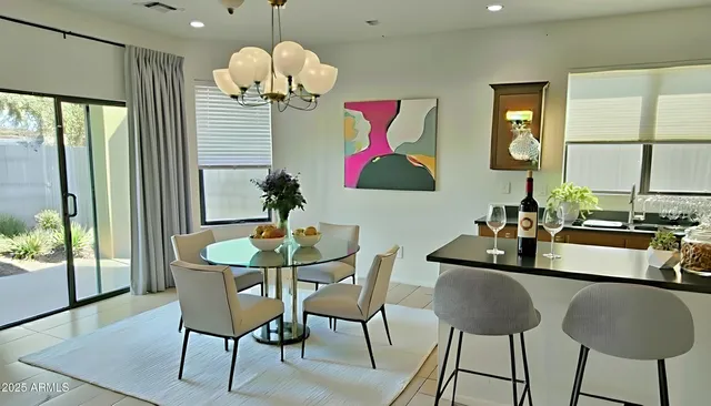a dining room with furniture and wooden floor