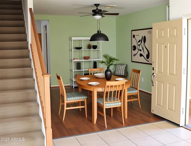 a dining room with furniture and wooden floor