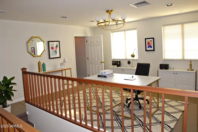 a workspace with furniture and window