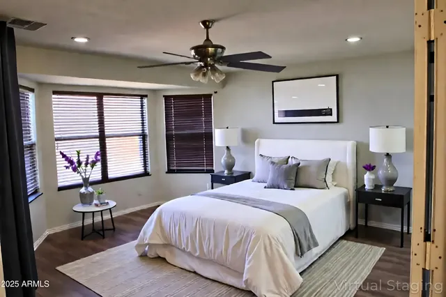 a bedroom with a bed and a table