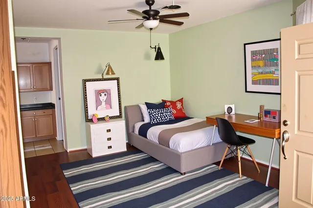 a bedroom with furniture and a chandelier