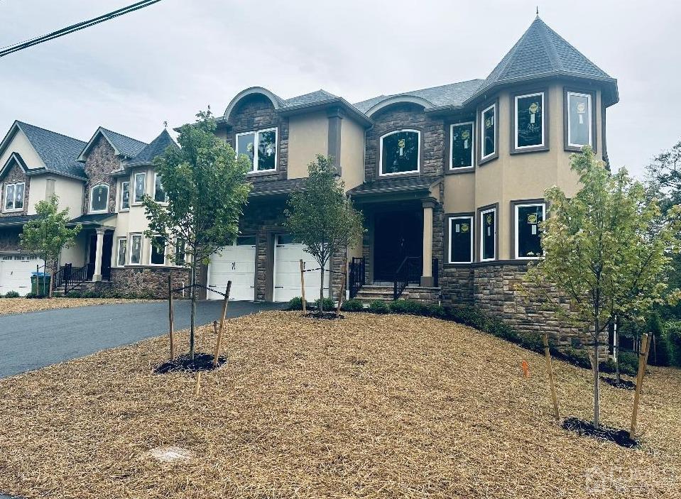 42 Broad Street Elizabeth, NJ 07202 - Photo 2 of 2 a front view of a house with a yard