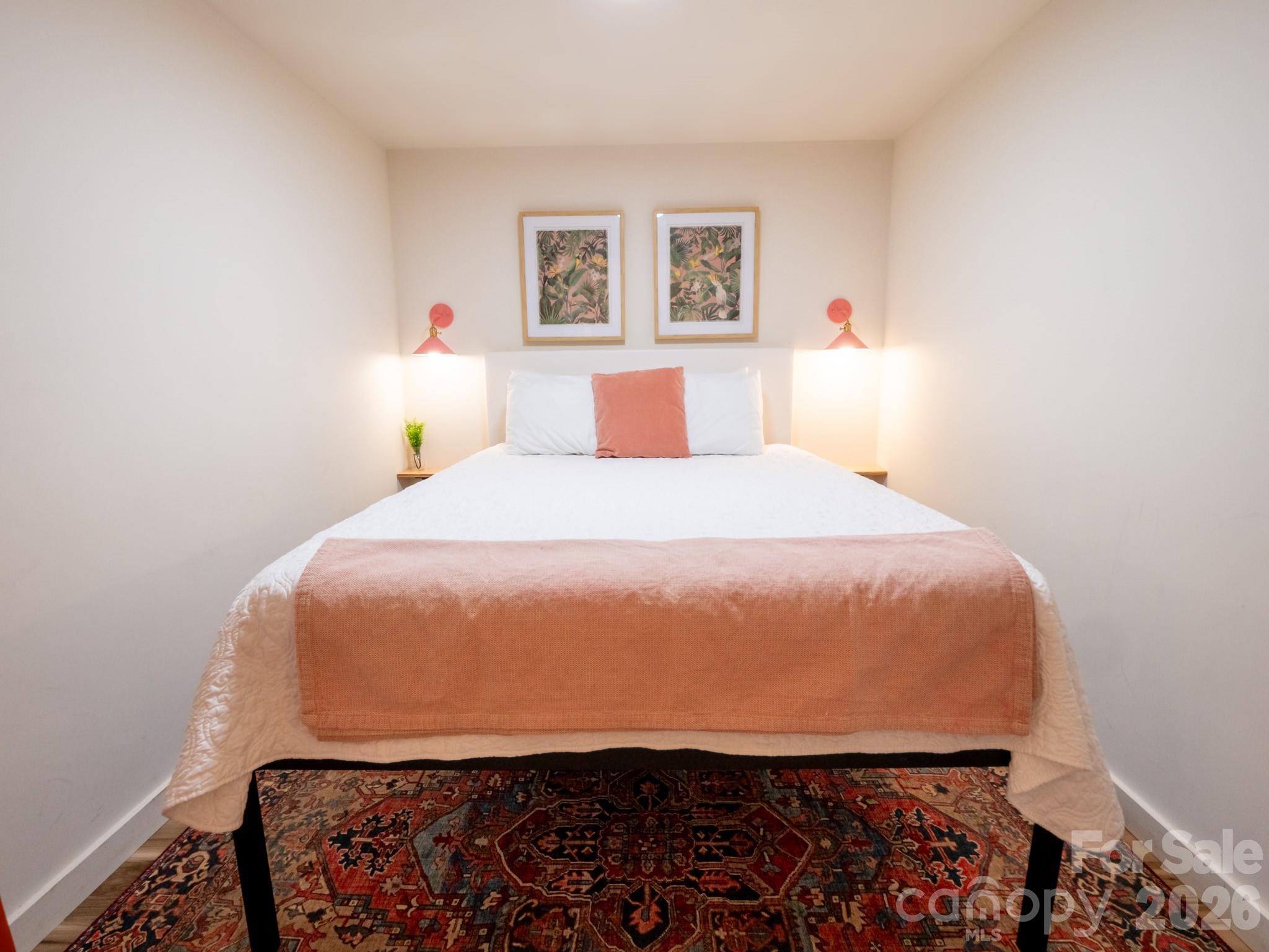 1048 Jenkins Valley Road Alexander, NC 28701 - Photo 19 of 25 a bedroom with a bed and wooden floor