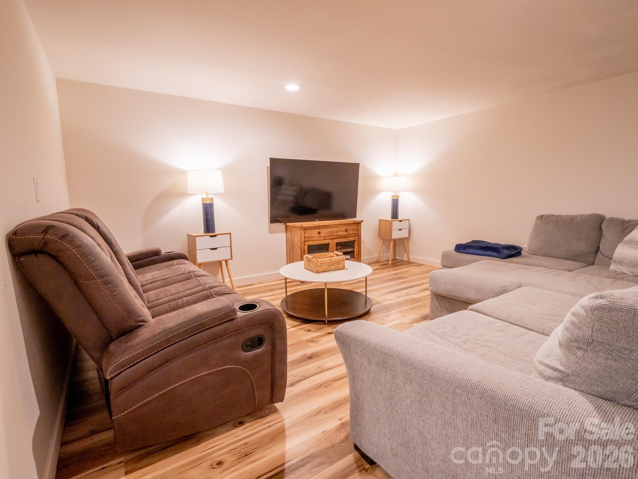 1048 Jenkins Valley Road Alexander, NC 28701 - Photo 21 of 25 a living room with furniture and a flat screen tv