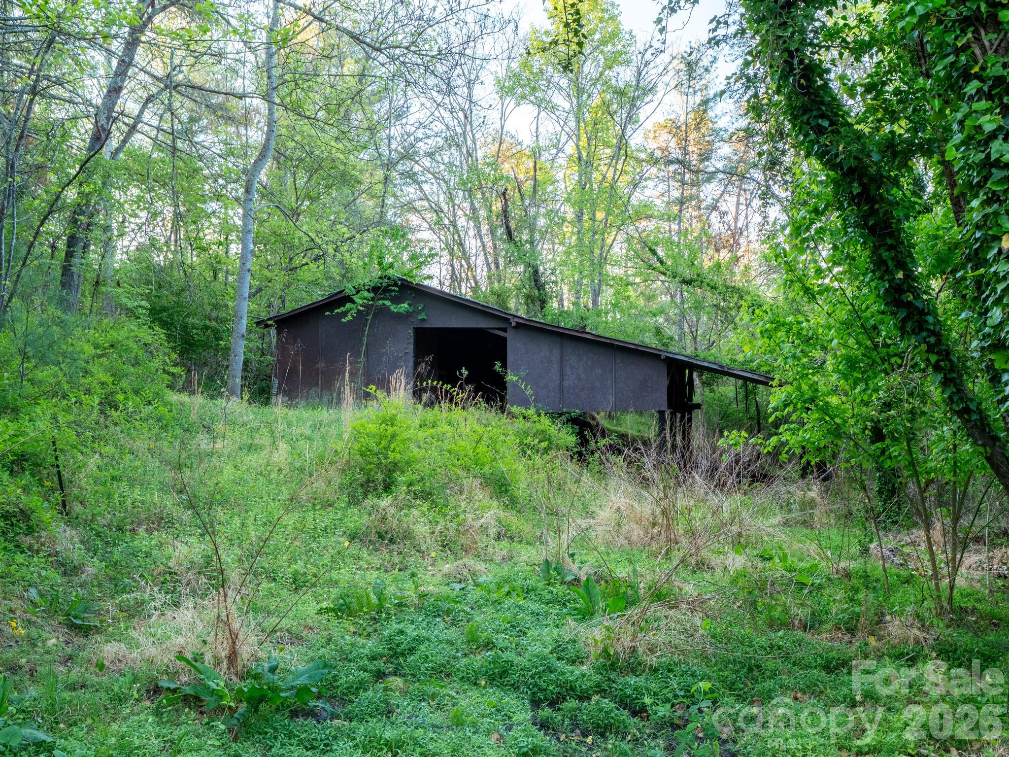 1048 Jenkins Valley Road Alexander, NC 28701 - Photo 23 of 25 a view of a house with a yard