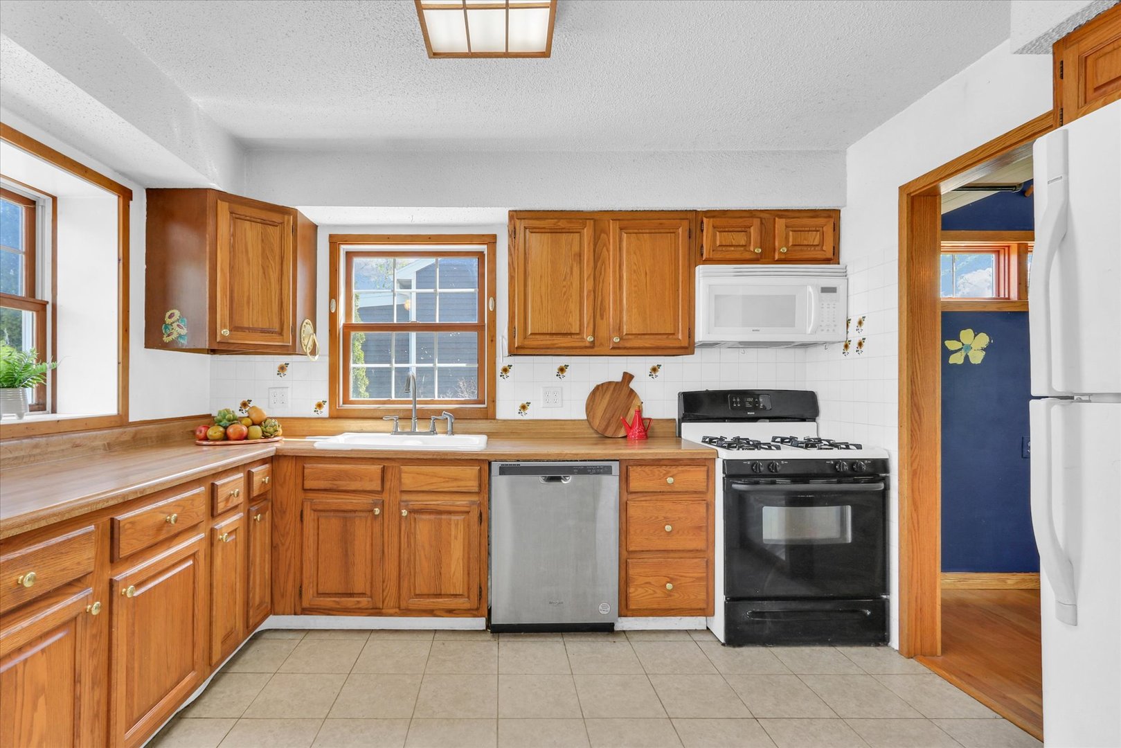 1108 Eastern Drive Urbana, IL 61801 - Photo 11 of 29 a kitchen with stainless steel appliances granite countertop a stove sink and cabinets