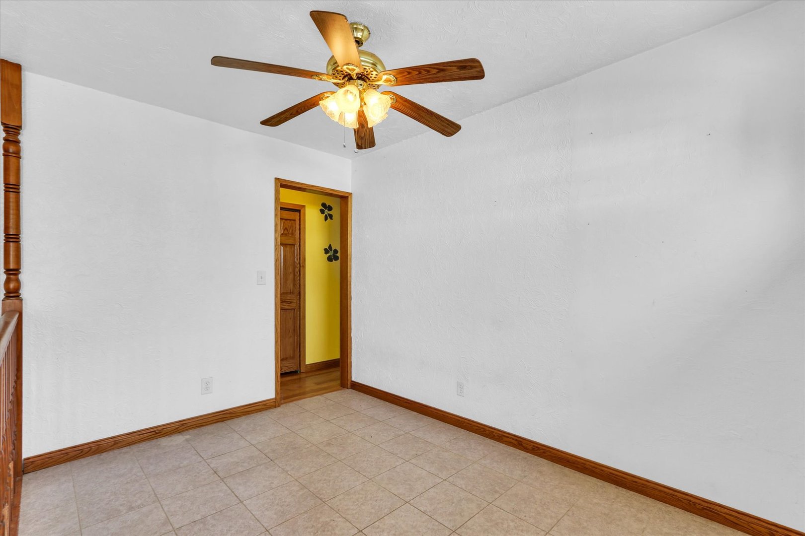 1108 Eastern Drive Urbana, IL 61801 - Photo 13 of 29 an empty room with a ceiling fan and a window