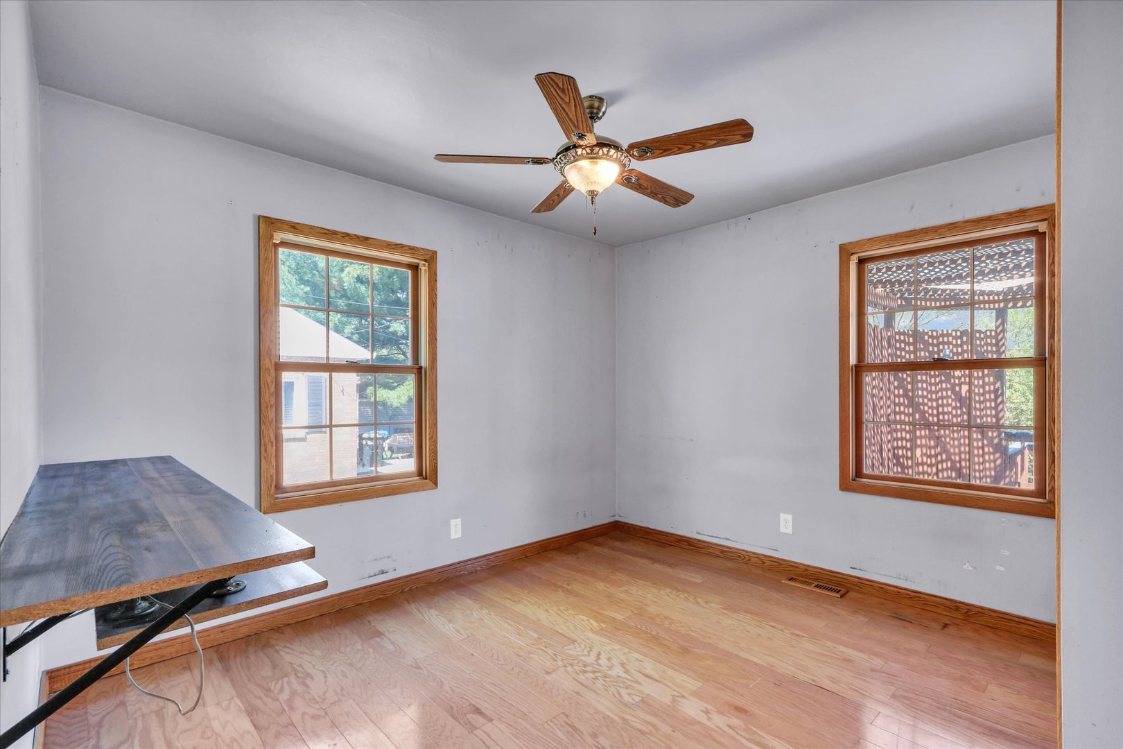 1108 Eastern Drive Urbana, IL 61801 - Photo 15 of 29 an empty room with windows and ceiling fan