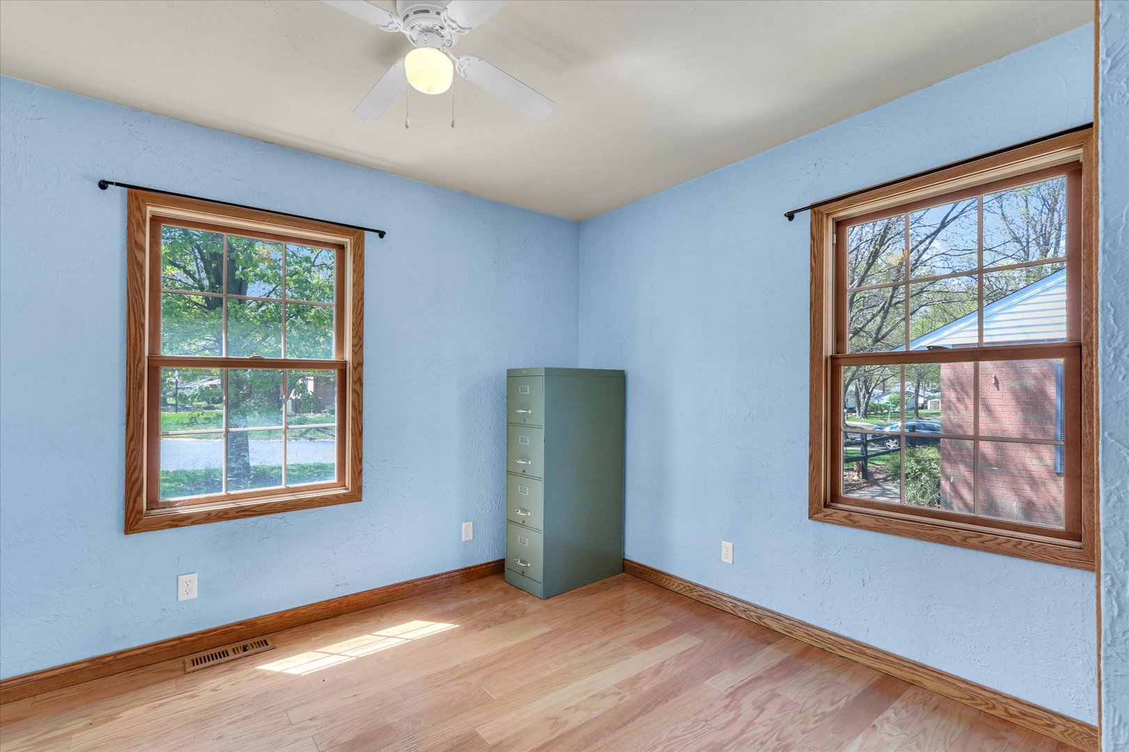 1108 Eastern Drive Urbana, IL 61801 - Photo 17 of 29 a view of an empty room with a window and wooden floor