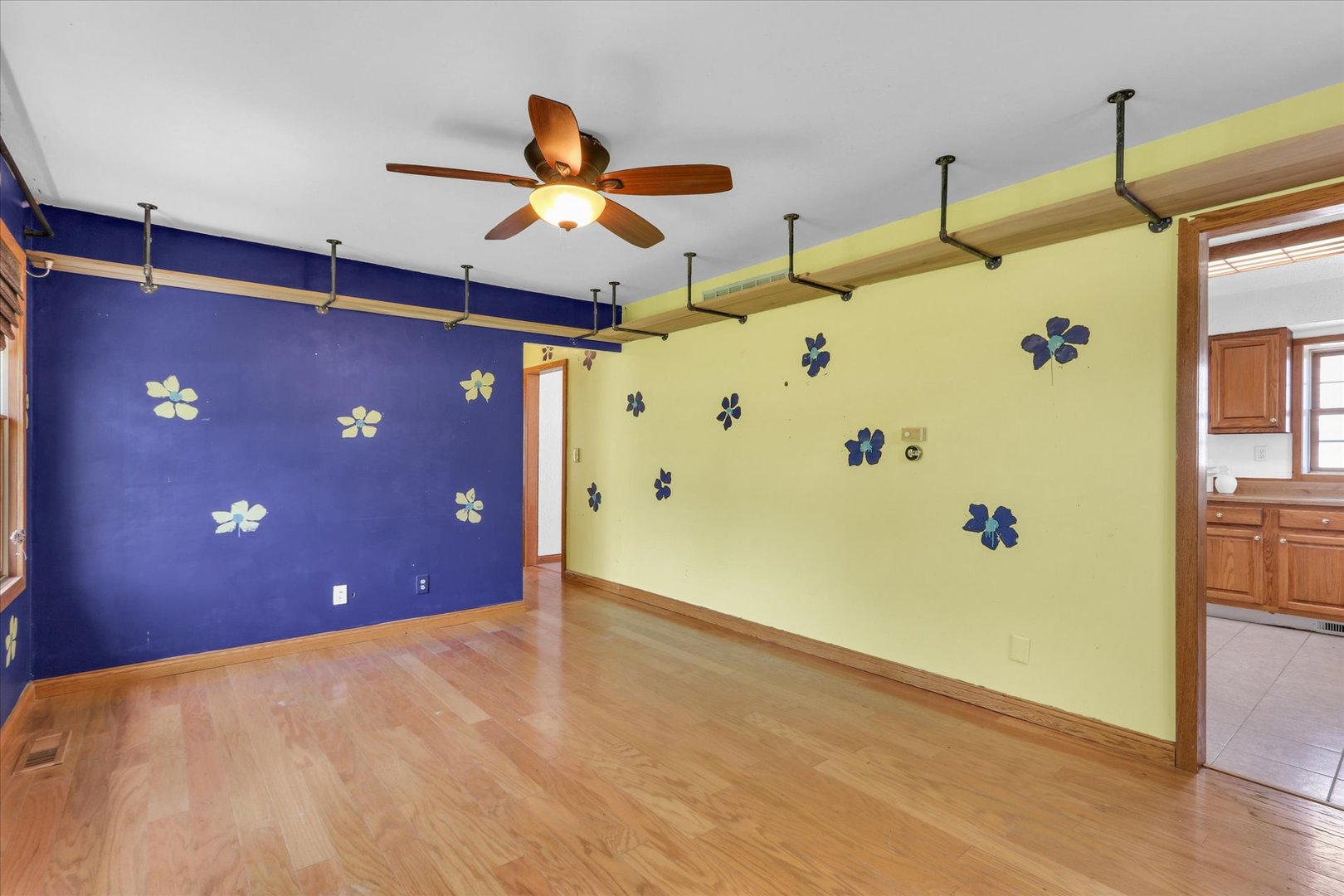 1108 Eastern Drive Urbana, IL 61801 - Photo 5 of 29 a view of a livingroom with a ceiling fan and wooden floor
