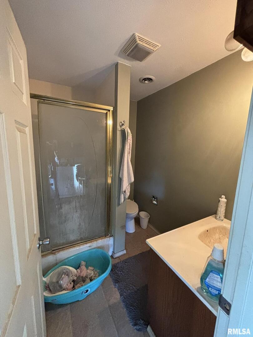 3152 Hotze Road Salem, IL 62881 - Photo 8 of 12 a bathroom with a sink toilet and shower