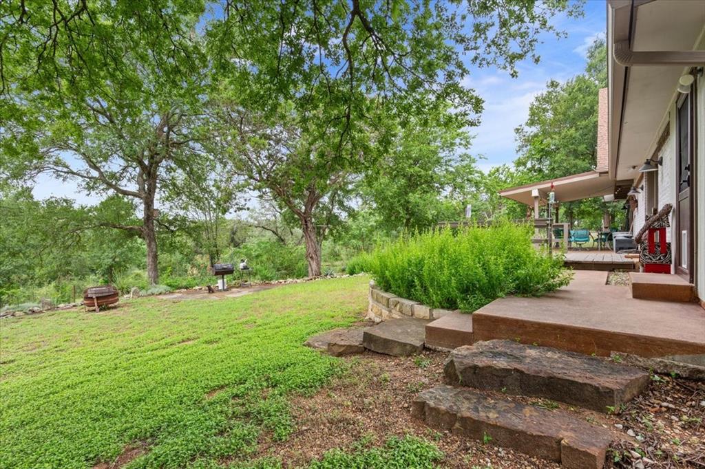 649 Wedgewood Drive China Spring, TX 76633 - Photo 30 of 39 View of grassy yard with a wooden deck