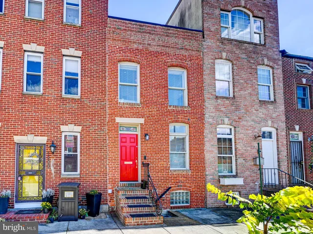 a front view of a building with many windows