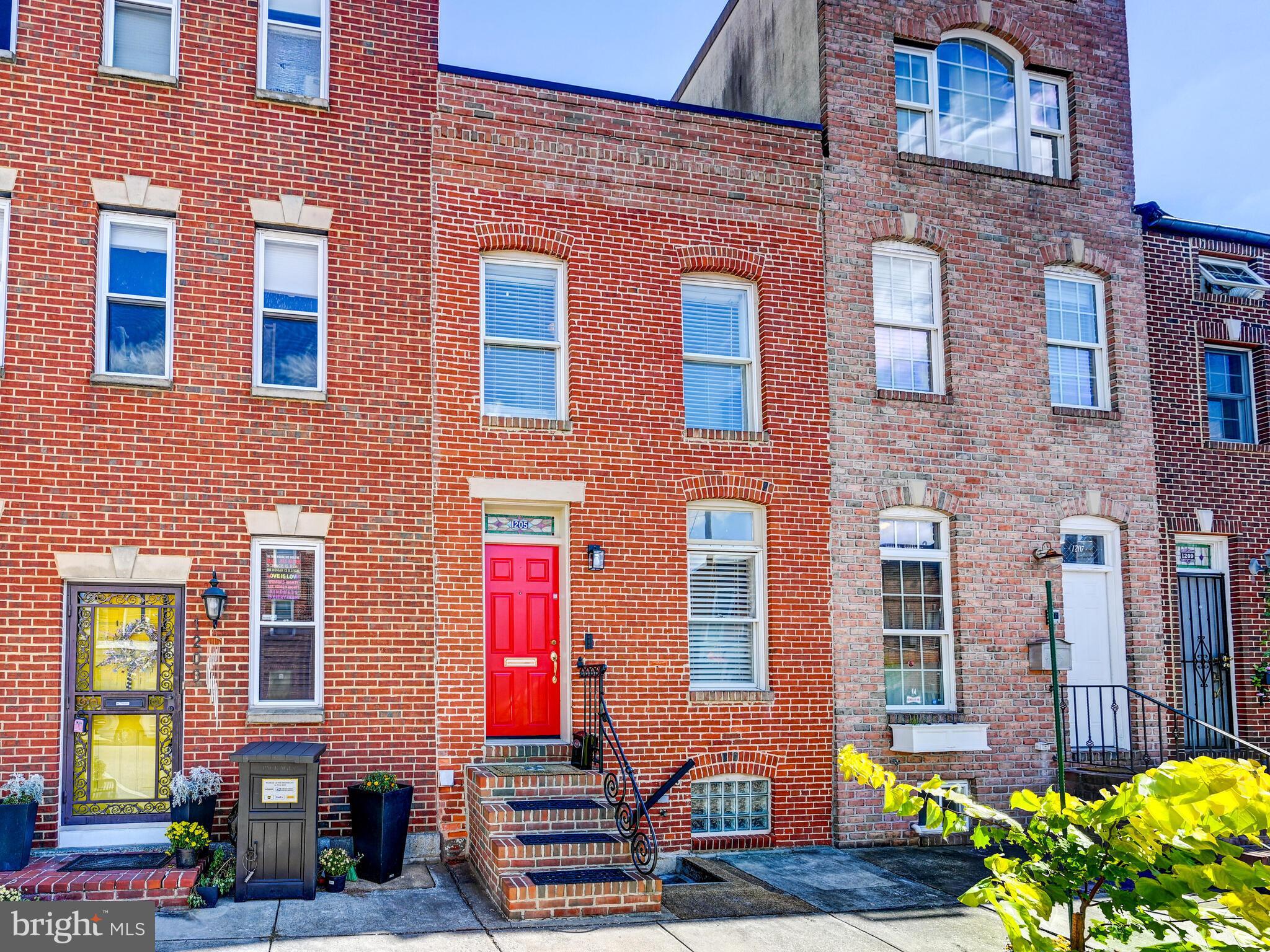 a front view of a building with many windows