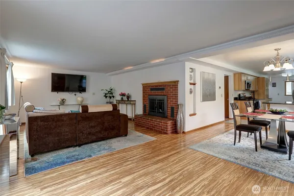 a living room with furniture and a fireplace or television