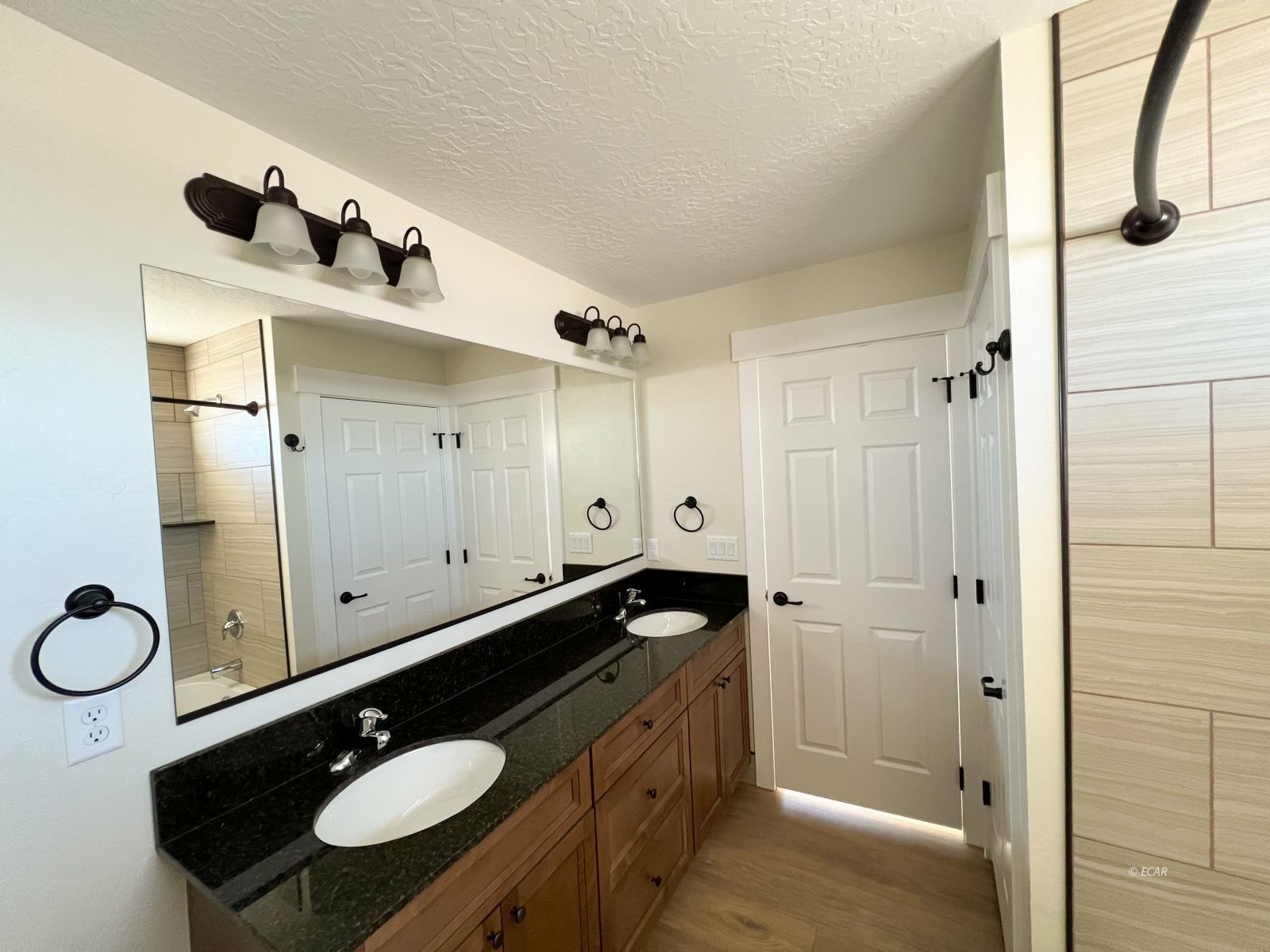 410 Ridgeway Drive Spring Creek, NV 89815 - Photo 17 of 26 a bathroom with a sink and a mirror