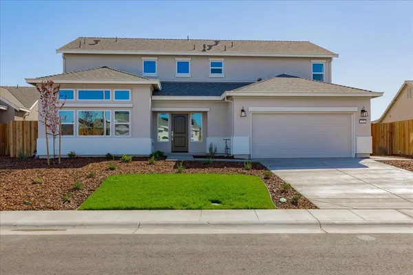 a front view of house with yard