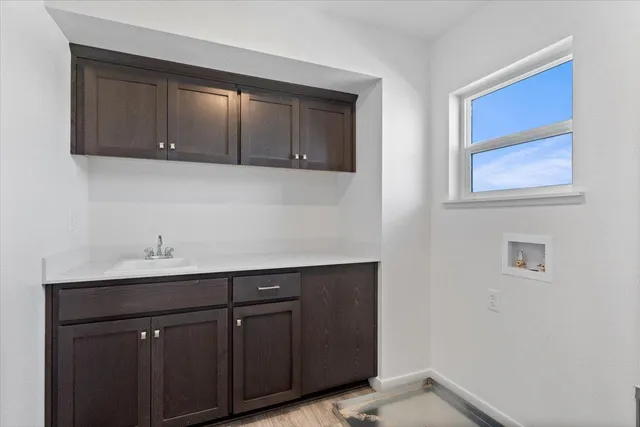 a kitchen with a sink and cabinets