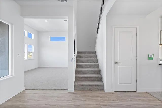 a view of entryway with wooden floor