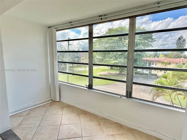 a view of a room with a large window