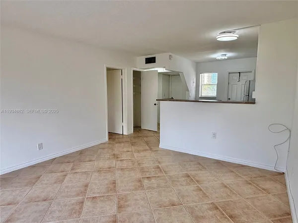 a view of a kitchen with a sink and cabinets