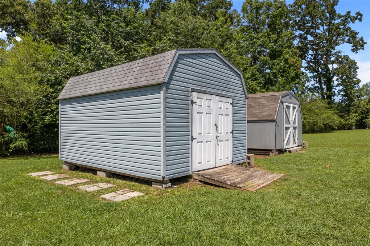 1112 Garners Creek Road Dickson, TN 37055 - Photo 41 of 57 a view of a house with a yard