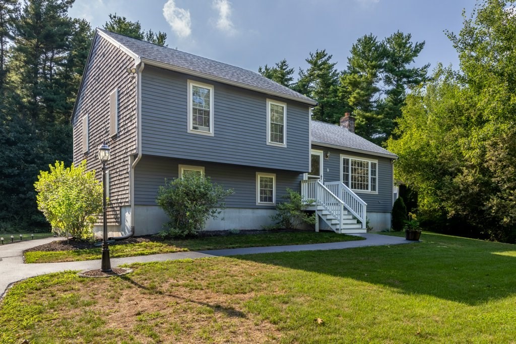 9 Boxberry Lane Rochester, MA 02770 - Photo 1 of 35 a front view of a house with garden