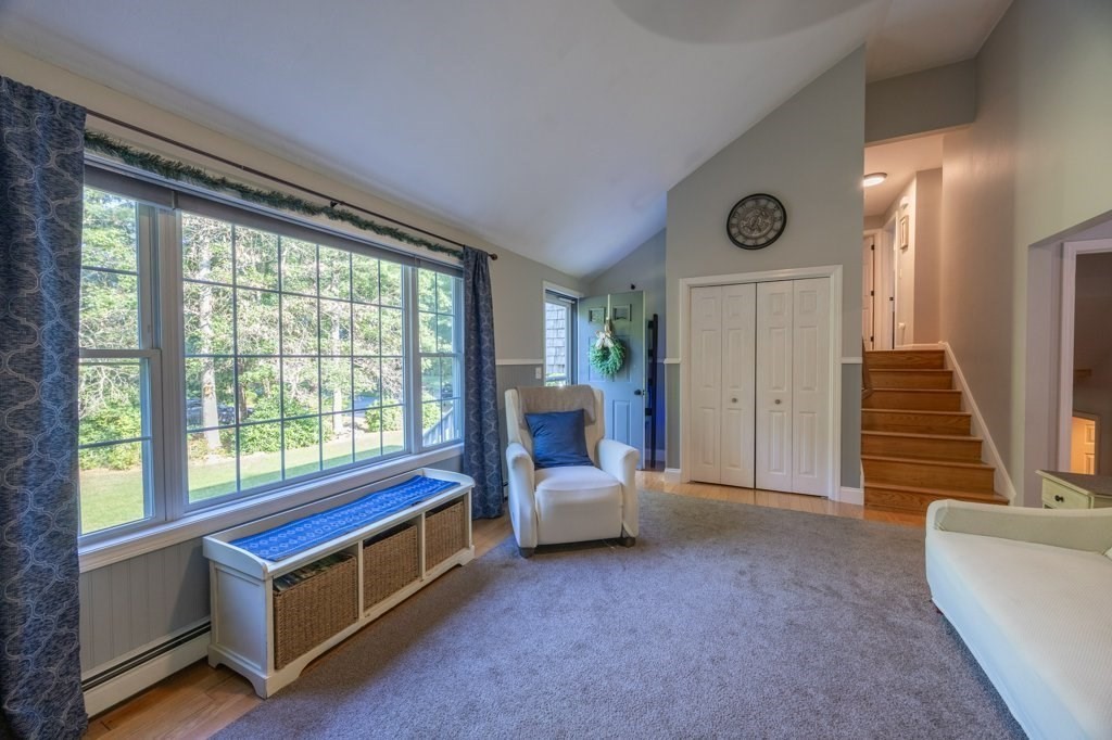 9 Boxberry Lane Rochester, MA 02770 - Photo 17 of 35 a living room with furniture and a large window