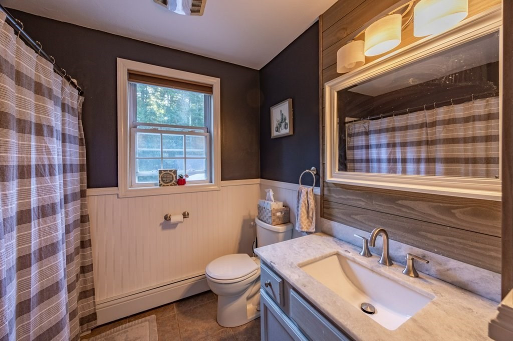 9 Boxberry Lane Rochester, MA 02770 - Photo 18 of 35 a bathroom with a sink a toilet and window