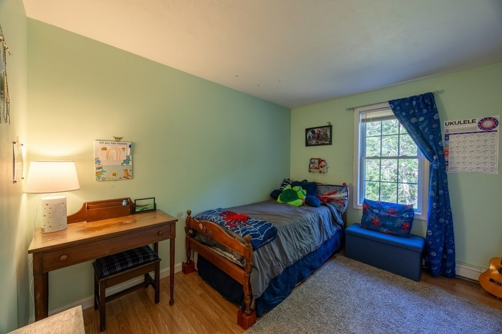 9 Boxberry Lane Rochester, MA 02770 - Photo 20 of 35 a bedroom with a bed and a window