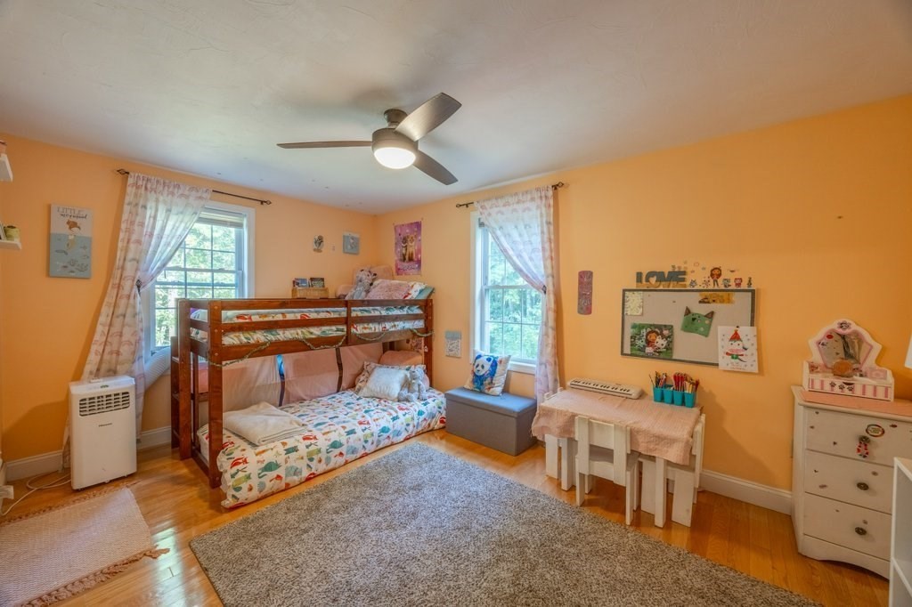 9 Boxberry Lane Rochester, MA 02770 - Photo 24 of 35 a bedroom with furniture and a large window