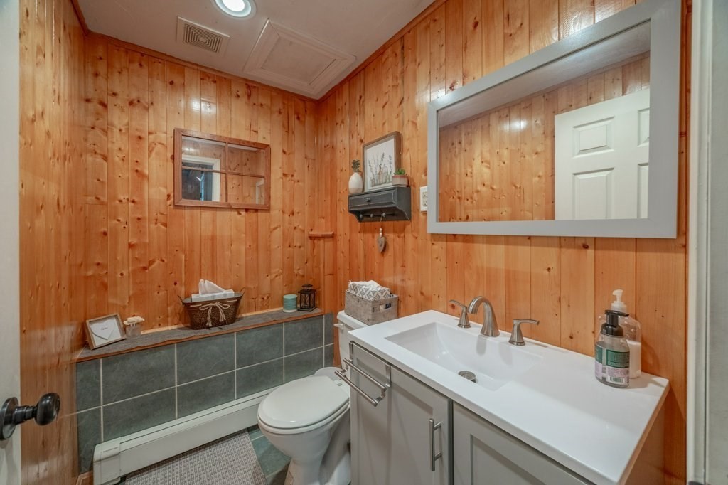 9 Boxberry Lane Rochester, MA 02770 - Photo 29 of 35 a bathroom with a sink a toilet and mirror