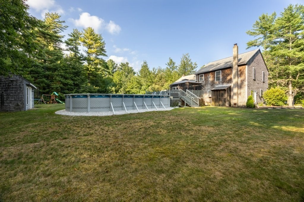 9 Boxberry Lane Rochester, MA 02770 - Photo 5 of 35 a view of a house with a yard