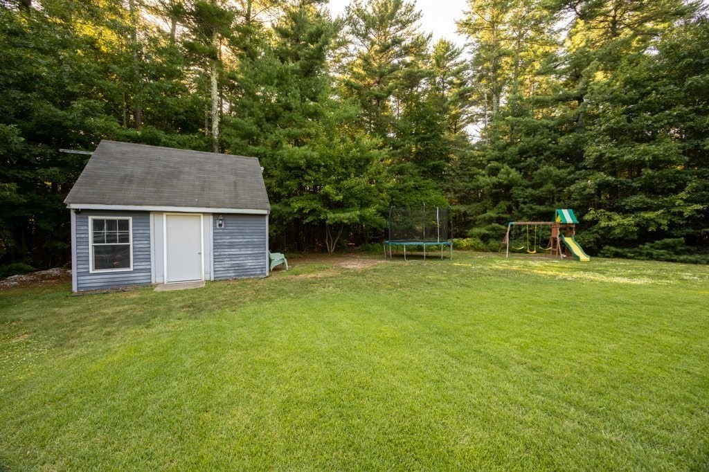 9 Boxberry Lane Rochester, MA 02770 - Photo 6 of 35 a house view with a garden space