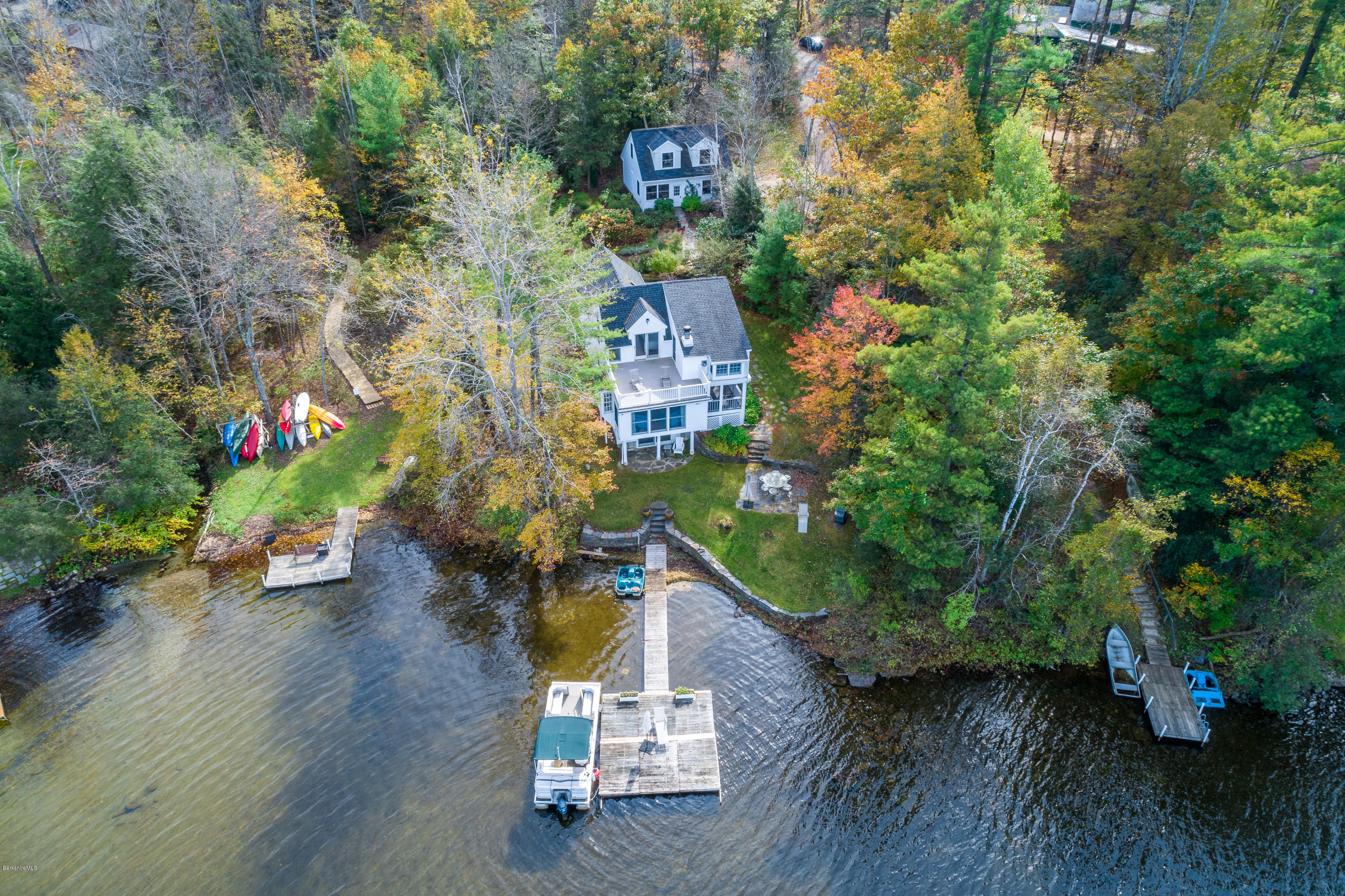 42 Lake Rd Extension Richmond, MA 01201 - Photo 1 of 40 an aerial view of a house with swimming pool and patio