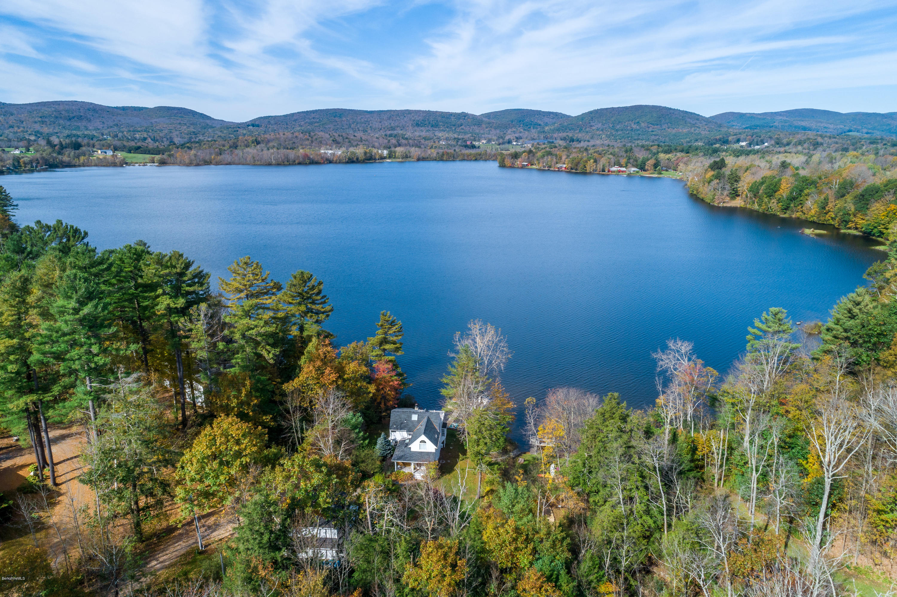 42 Lake Rd Extension Richmond, MA 01201 - Photo 3 of 40 a view of a lake with houses in the back