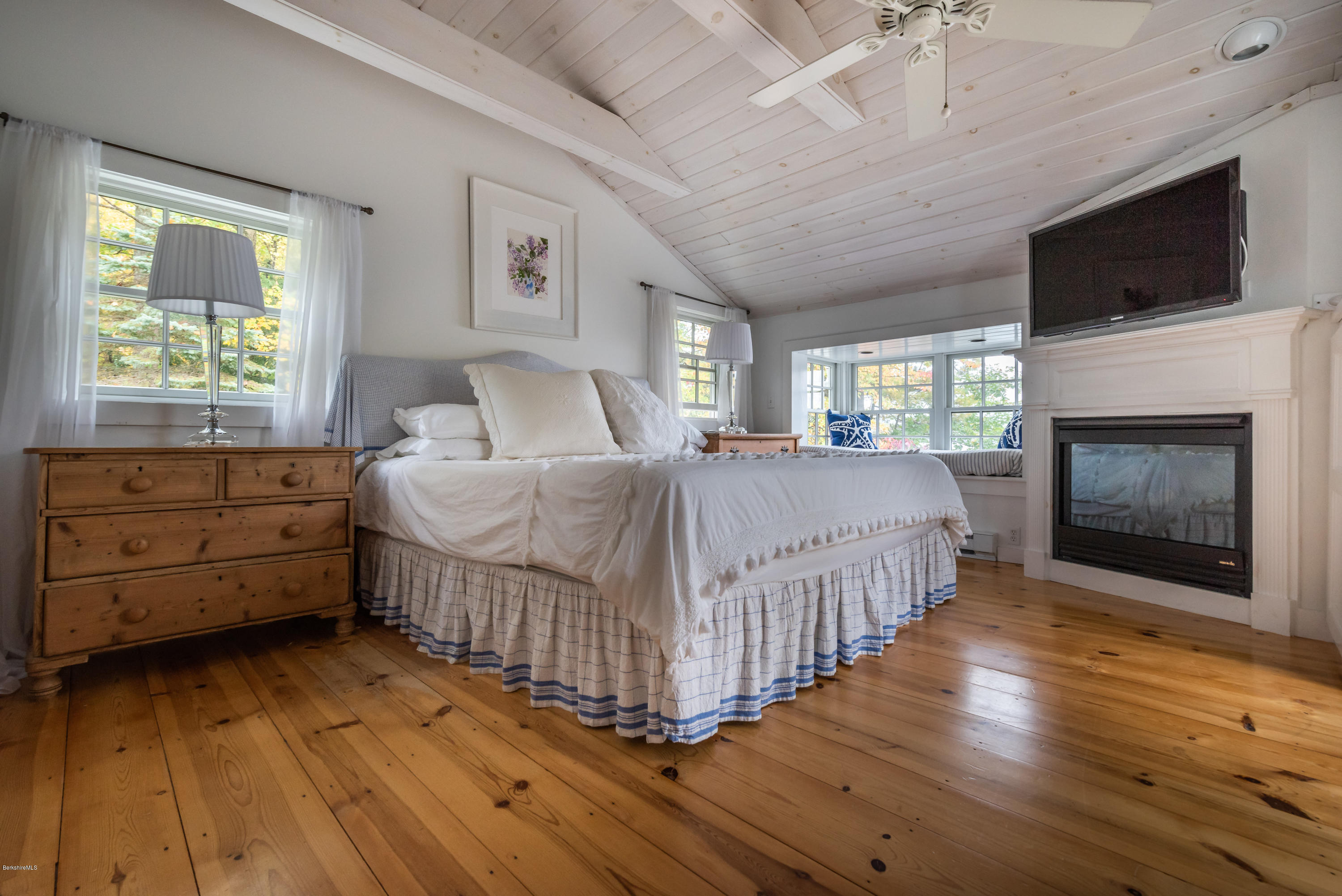 42 Lake Rd Extension Richmond, MA 01201 - Photo 24 of 40 a room with a bed and a fireplace