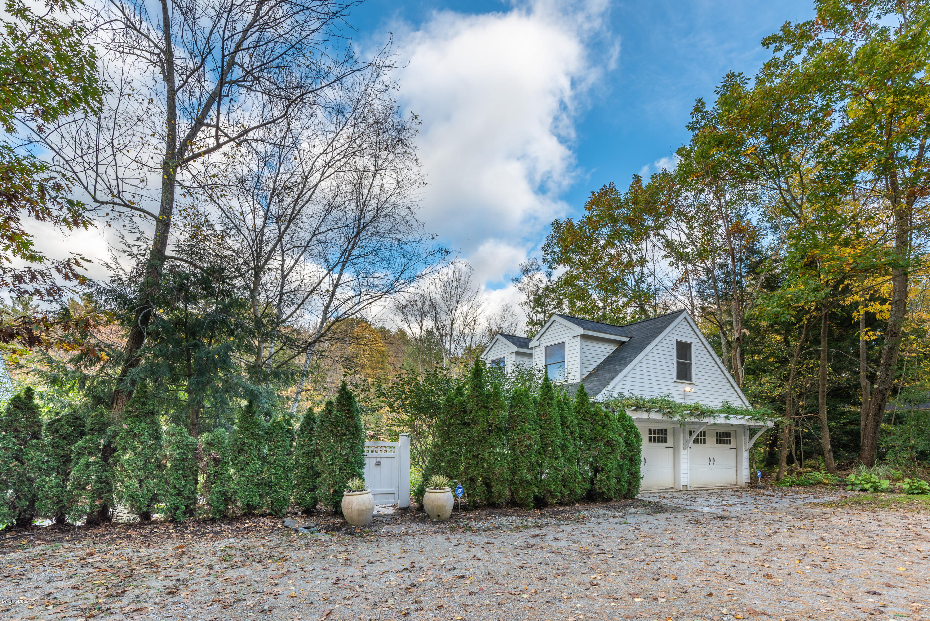 42 Lake Rd Extension Richmond, MA 01201 - Photo 35 of 40 a front view of a house with a garden